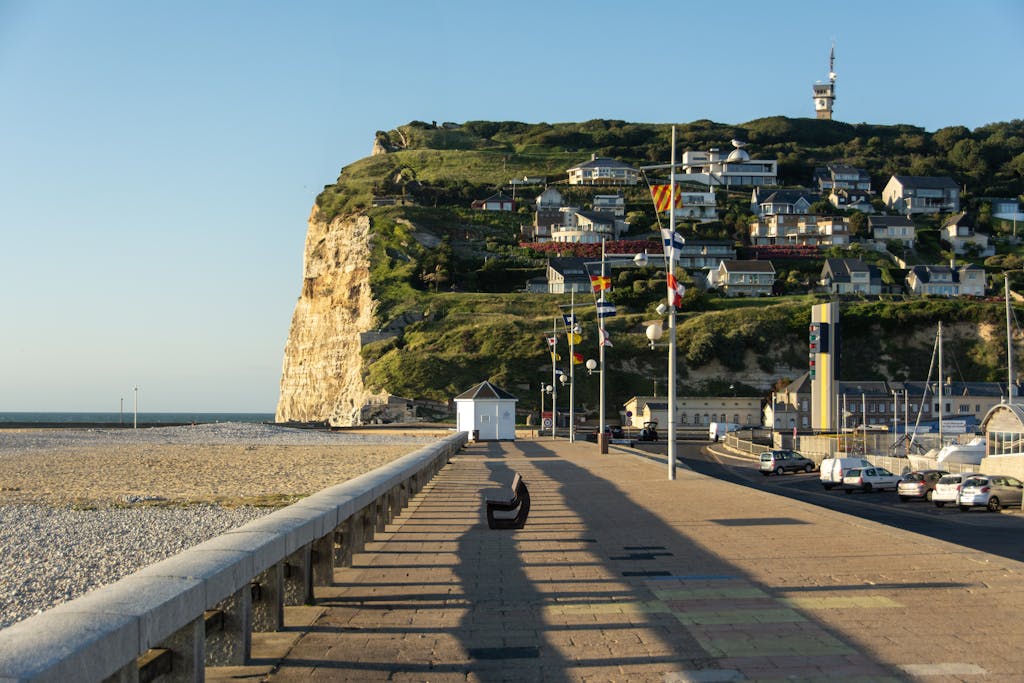 A beautiful morning view of the Fécamp coastline in Normandy, France showcasing cliffs and architecture.